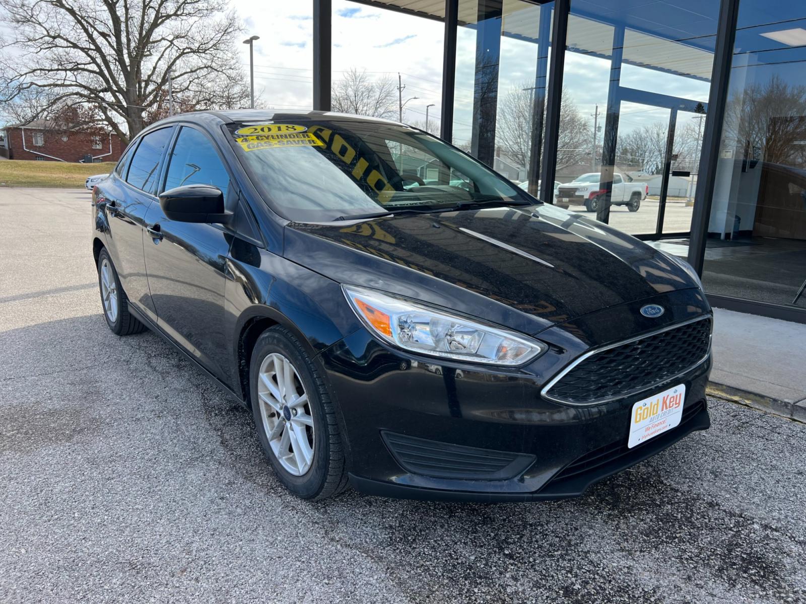 2018 Shadow Black Ford Focus SEDAN 4-DR (1FADP3FE7JL) with an 1.0L L3 engine, located at 1633 W Kimberly, Davenport, IA, 52806, (563) 323-5341, 41.559456, -90.598732 - Photo #1